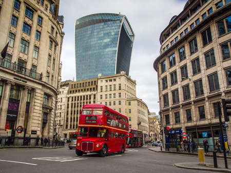 UNITED KINGDOM, LONDON - APRIL 5, 2015: Iconic old style double decker bus on London streets with the Walkie Talkie building in backgroundのeditorial素材