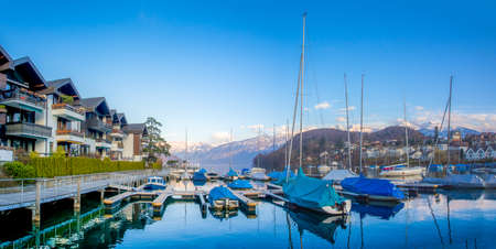 panorama of the yachts and boats lake thun in the town of Spiez, Switzerland.のeditorial素材