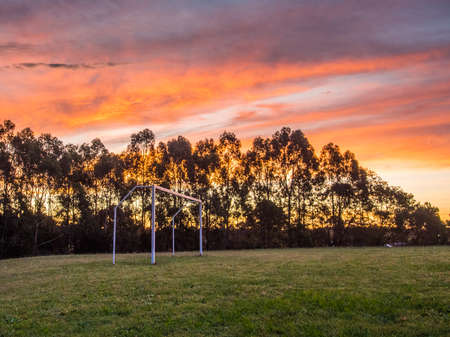Soccer or football goals in a beautiful afternoon sunsetの写真素材