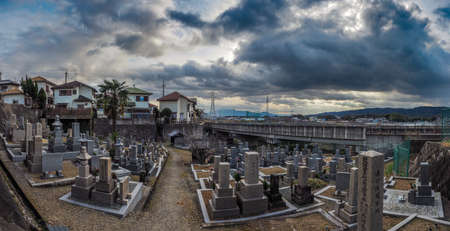 JAPAN, NARA - DECEMBER 28, 2017: A cemetary in Japan with dark dramtic clouds aboveのeditorial素材