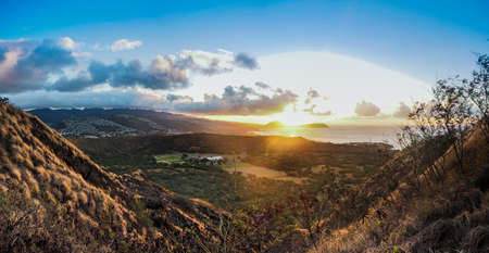 Sun rising over Hawaii and Diamond Head crater