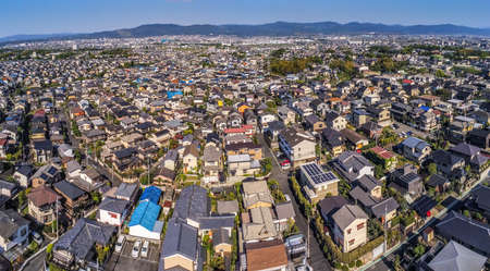 Aerial view of condensed houses and narrow streets in typical Japanese suburb of Nara Japanの写真素材