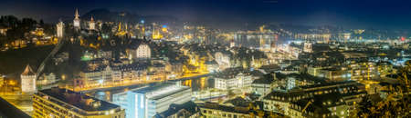Night view of illuminated lights of old town of Lucerne city with wooden Chapel bridge and Reuss riverの写真素材