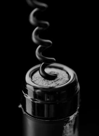 Uncorking a bottle of red wineの写真素材