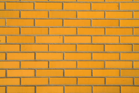background with yellow bricks wall for designの写真素材