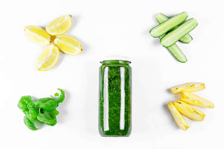 of healthy smoothies in a jar on a white background with ingredientsの写真素材