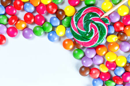Multicolored candy on light painted background. Top view.の写真素材