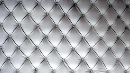texture of gray quilted leather with rivets close upの写真素材