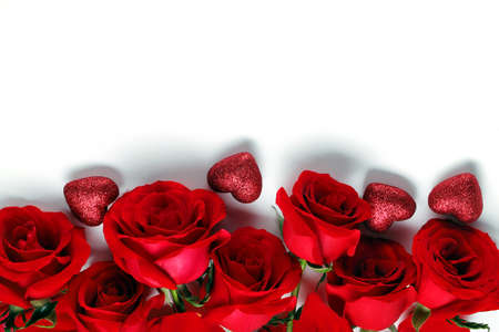 flowers of red roses with hearts near