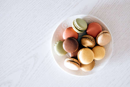 macarons in a plate on a white background