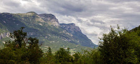 A mountain surrounded by clouds