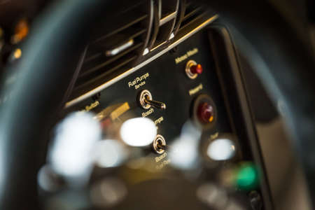 Closeup view of inside of a supercar. Steering wheel controlsの写真素材