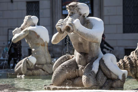 A lovely day of snow in Rome, Italy, 26th February 2018: a beautiful view of Navona Square and Fontana dei Quattro Fiumi (Fountain of Four Rivers) under the snowのeditorial素材