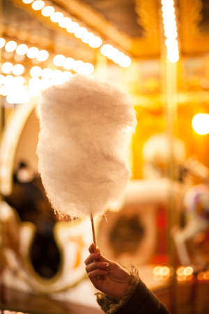 A cotton candy in front of an ancient German Horse Carousel built in 1896 in Navona Square, Rome, Italyの写真素材