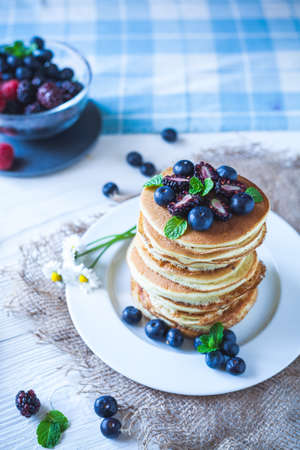 Delicious homemade pancakes with berriesの写真素材