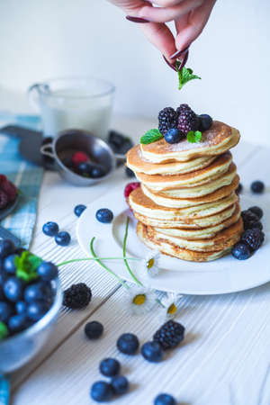 Delicious homemade pancakes with berriesの写真素材