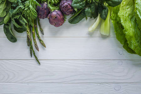 Mix of vegetables on wooden background
