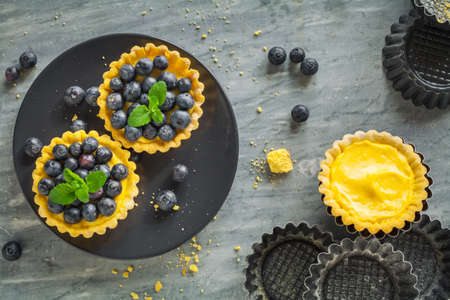 blueberries egg tart on the plate.