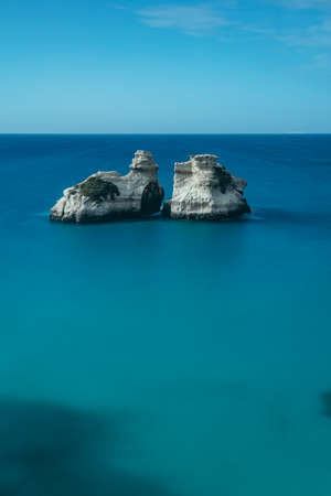 The "Two Sisters" rock in Torre dell'Orso, Malendugno, Puglia, Italyの写真素材