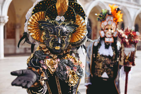Portrait of a couple with beautiful masks in Venice, Italyの写真素材