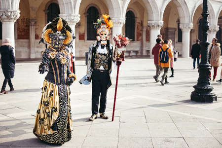 Portrait of a couple with beautiful masks in Venice, Italyの写真素材