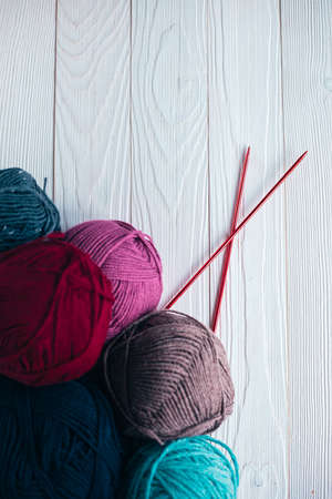 Some colored wool balls on the tableの写真素材