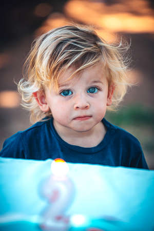 Little happy child celebrates his two years