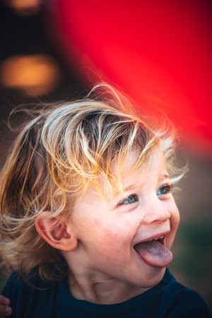 Little funny child celebrates his two yearsの写真素材