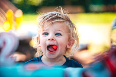 Little funny child celebrates his two yearsの写真素材