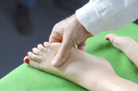 foot massage doctor and patientの写真素材