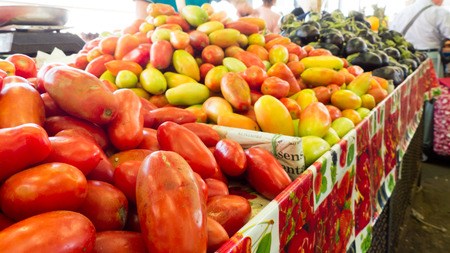 tomatoes on the greengrocer benchの写真素材