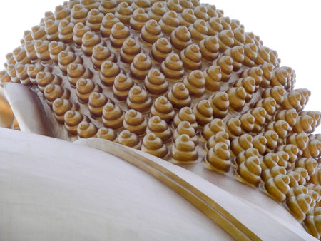 a particular of the rear side of the head of a giant golden buddah statue  in thailandのeditorial素材