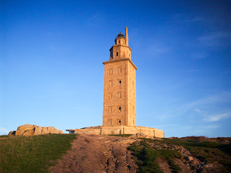 a lighthose in la coruna, spain on a blue sky backgroundの写真素材