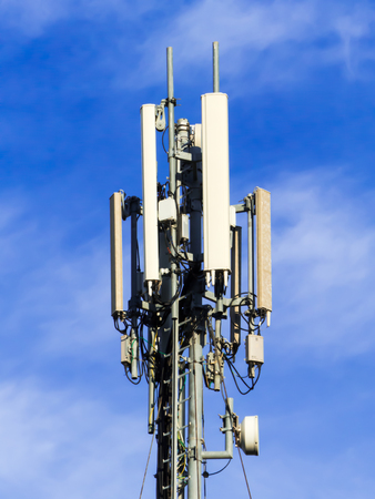 a digital telephone antenna on a blue sky background