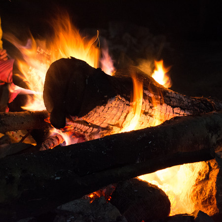 A campfire in the mountains prepared for bbq at night