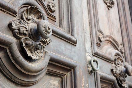 an ancient italian door on an italian building in taranto, in the south of italyの写真素材