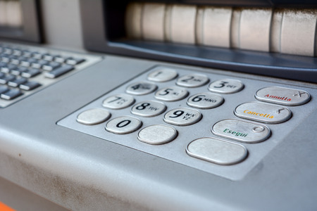 a closeup of the keyboard of an italian atm
