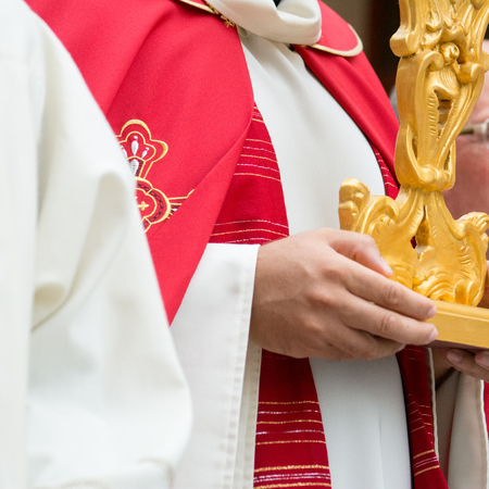 detail of the trditional dresses of christian confraternity members during a processionの写真素材