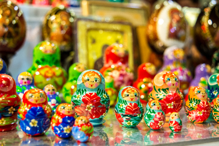 colored matrioskas at the russian shop on blur backgroundの写真素材