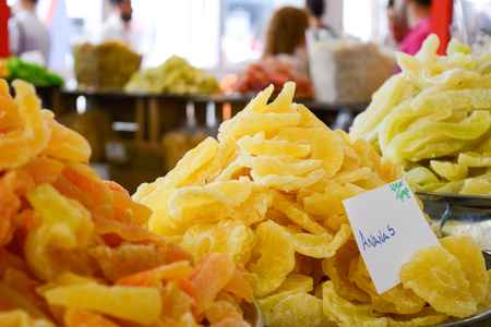 dried ananas in a stall at the market on blur backgroundの写真素材