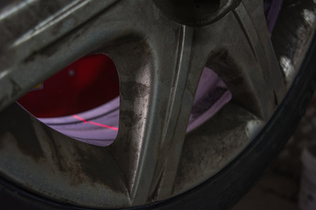 detail of the laser light of the balance machine at the tire shopの写真素材