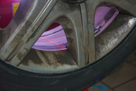 detail of the laser light of the balance machine at the tire shopの写真素材