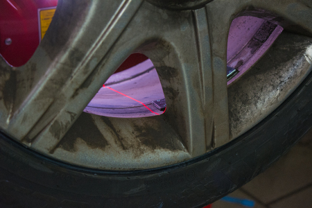detail of the laser light of the balance machine at the tire shopの写真素材