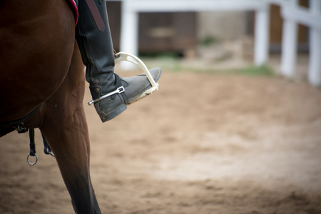 close up of a foot inside the stirrups on blur backgroundの写真素材