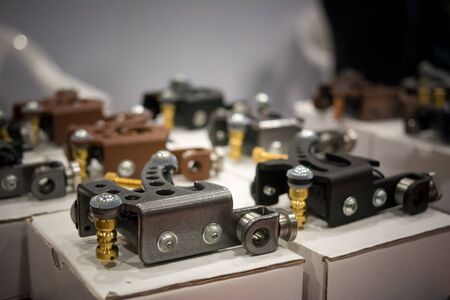 close up of a collection of tattoo machines in exposition at the tattoo conventionの写真素材