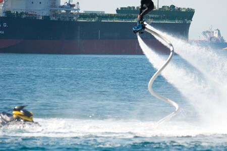 flyboard show in the ionian sea on blur background