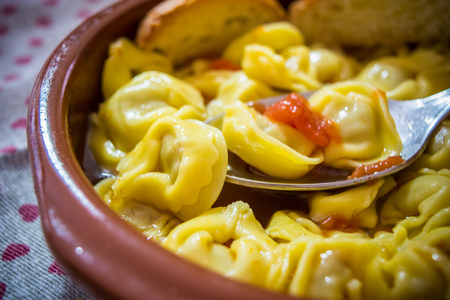 Italian Traditional Food Called Tortellini In Brodo With Bread. A Good Food For Christmas And Winter Period.の写真素材