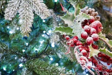 Close Up Of  Snowy Christmas Tree With Decoration On Snowy Backgroundの写真素材