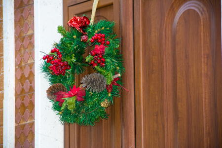 Christmas Decoration On a Wooden Door in Italyの写真素材