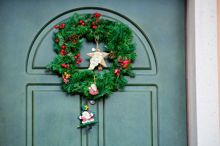Christmas Decoration On a Cyan Door in Italyの写真素材